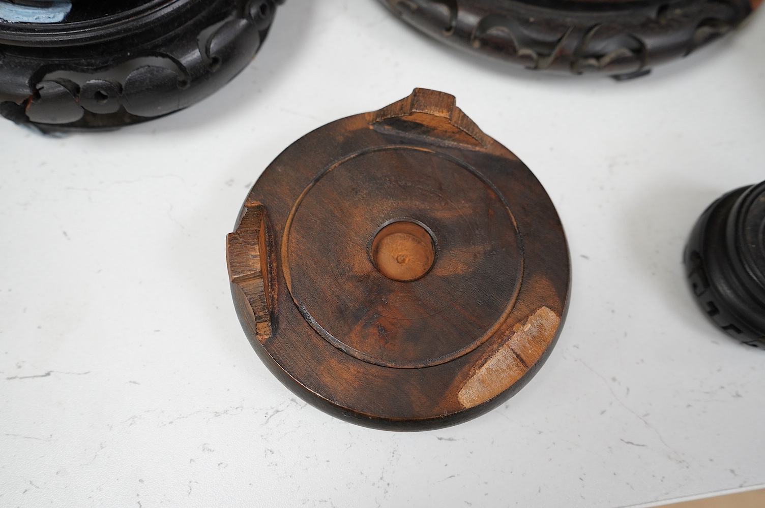 A group of Chinese hardwood stands largest 21cm in diameter. Condition - fair, some chips